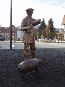 Bauer mit Schwein             